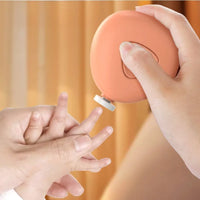Baby electric nail trimmer set shown with packaging