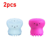 Silicone facial cleansing brush being used on skin